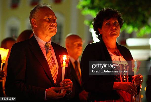 Erwin Huber , head of the Christian Social Union and politician Ingrid Heckner are seen during a katholic light procession on August 14, 2008 in...