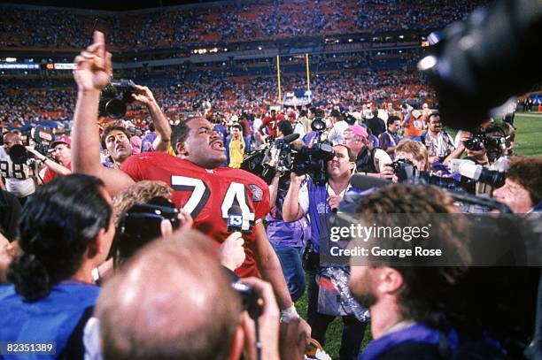 Offensive tackle Steve Wallace of the San Francisco 49ers celebrates after the 49ers defeating the San Diego Chargers in Super Bowl XXIX at Joe...