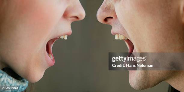 close-up of a couple shouting, kiev, ukraine - aggressione foto e immagini stock