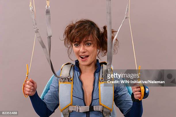 young woman with a parachute, kiev, ukraine - indoor skydive stock pictures, royalty-free photos & images