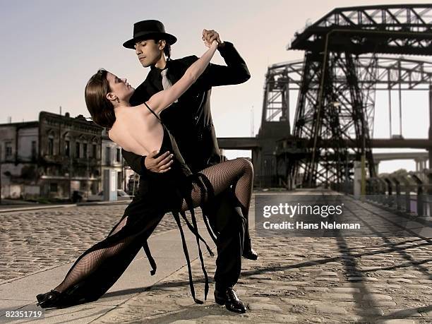 young couple dancing on the street, caminito, la boca, argentina  - tango argentina stock pictures, royalty-free photos & images