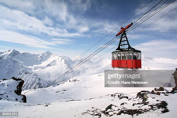 overhead cable car moving through steel cables, russia  - cable car stock pictures, royalty-free photos & images