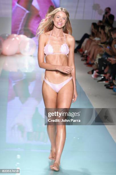 Model walks the runway at the LOLLI SWIM fashion show during FUNKSHION Swim Fashion Week at Funkshion Tent on July 21, 2017 in Miami Beach, Florida.