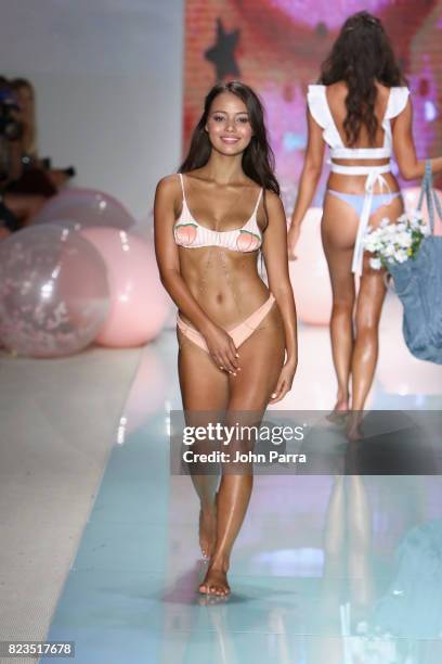 Model walks the runway at the LOLLI SWIM fashion show during FUNKSHION Swim Fashion Week at Funkshion Tent on July 21, 2017 in Miami Beach, Florida.