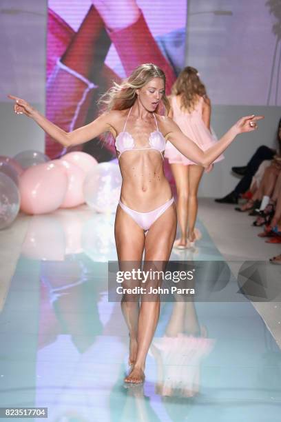 Model walks the runway at the LOLLI SWIM fashion show during FUNKSHION Swim Fashion Week at Funkshion Tent on July 21, 2017 in Miami Beach, Florida.