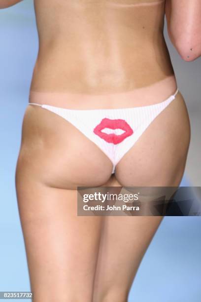 Model walks the runway at the LOLLI SWIM fashion show during FUNKSHION Swim Fashion Week at Funkshion Tent on July 21, 2017 in Miami Beach, Florida.