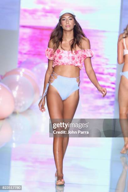 Model walks the runway at the LOLLI SWIM fashion show during FUNKSHION Swim Fashion Week at Funkshion Tent on July 21, 2017 in Miami Beach, Florida.