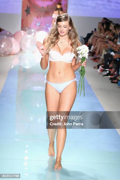 Model walks the runway at the LOLLI SWIM fashion show during FUNKSHION Swim Fashion Week at Funkshion Tent on July 21, 2017 in Miami Beach, Florida.