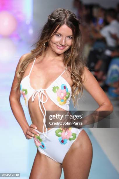 Model walks the runway at the LOLLI SWIM fashion show during FUNKSHION Swim Fashion Week at Funkshion Tent on July 21, 2017 in Miami Beach, Florida.