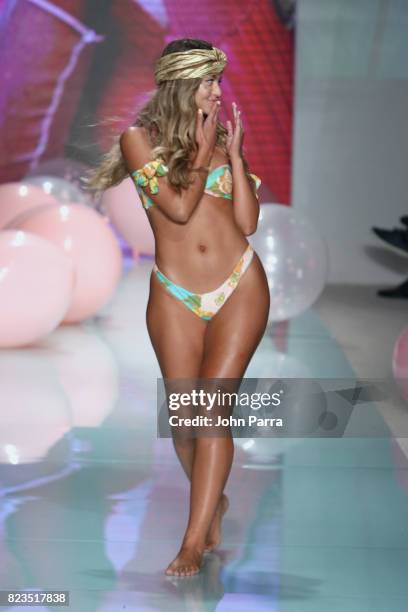 Model walks the runway at the LOLLI SWIM fashion show during FUNKSHION Swim Fashion Week at Funkshion Tent on July 21, 2017 in Miami Beach, Florida.