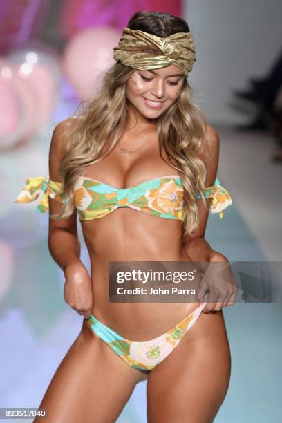 Model walks the runway at the LOLLI SWIM fashion show during FUNKSHION Swim Fashion Week at Funkshion Tent on July 21, 2017 in Miami Beach, Florida.