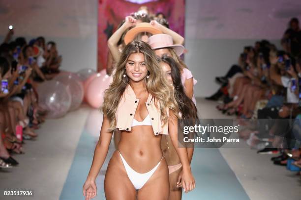 Models walk the runway at the LOLLI SWIM fashion show during FUNKSHION Swim Fashion Week at Funkshion Tent on July 21, 2017 in Miami Beach, Florida.