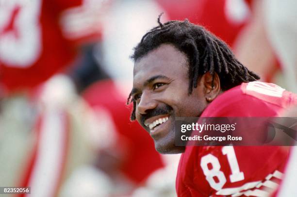 Tight end Jamie Williams of the San Francisco 49ers looks on with a smile as he takes a rest on the bench during a game against the Tampa Bay...