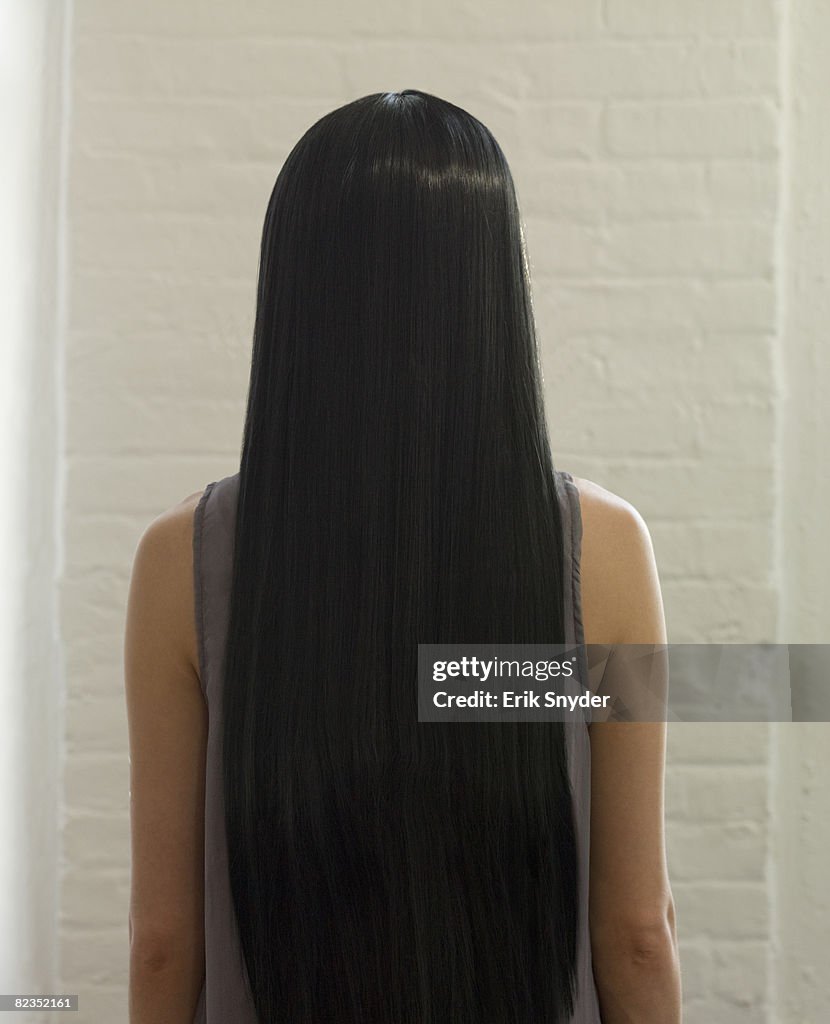 Woman With Long Dark Straight Hair High-Res Stock Photo - Getty Images