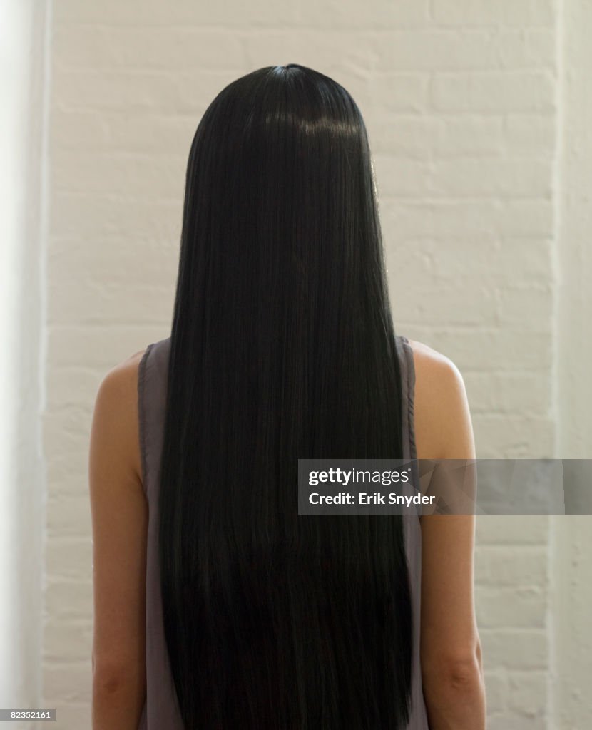 Woman with long, dark, straight hair