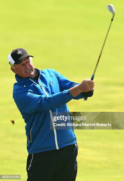 Sandy Lyle of Scotland hits his second shot on the 2nd hole during the first round of the Senior Open Championship presented by Rolex at Royal...