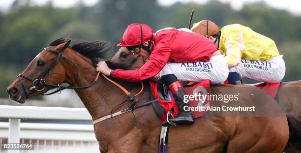 Adam Kirby riding Finale win The ROA/Racing Post Owners Jackpot Handicap Stakes at Sandown Park racecourse on July 27, 2017 in Esher, England.