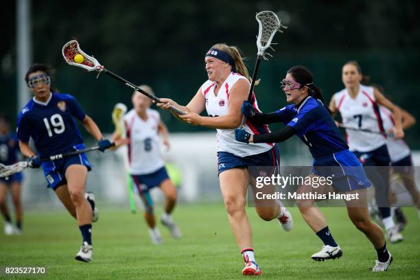 Sophie Morrill of Great Britain is challenged by Nozomi Tanaka of Japan during the Lacrosse Women's match between Great Britain and Japan of The...