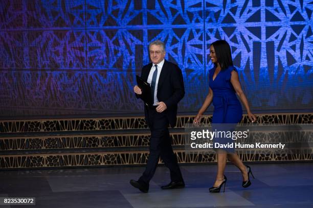 Actors Robert De Niro and Angela Bassett walk onstage at the opening of the National Museum of African American History and Culture, Washington DC,...