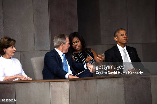 View of former First Lady Laura Bush, former President George W Bush, First Lady Michelle Obama, and President Barack Obama as they attend the...