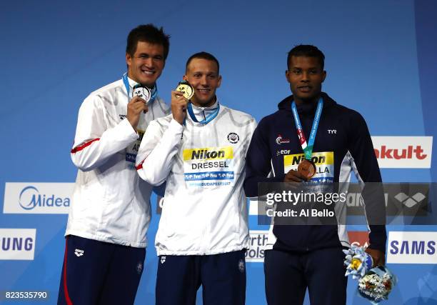 Silver medalist Nathan Adrian of the United States and gold medalist Caeleb Remel Dressel of the United States and bronze medalist Mehdy Metella of...