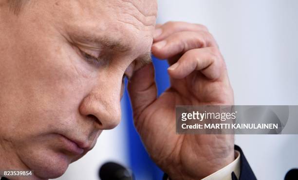 Russian President Vladimir Putin attends a joint press conference with Finnish President at the Hotel Punkaharju in Savonlinna, Eastern Finland, on...