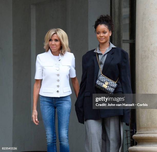 France’s First Lady Brigitte Macron receives singer and songwriter Rihanna at the Elysée Palace on July 26, 2017 in Paris. Main issue of the visit...