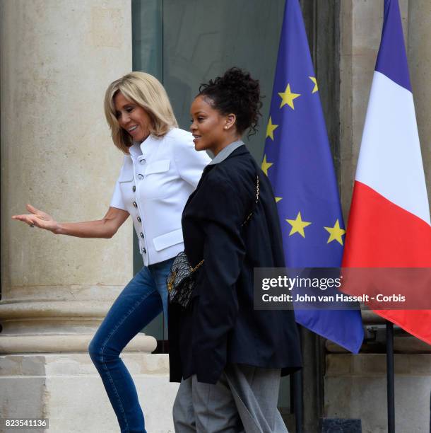 France’s First Lady Brigitte Macron receives singer and songwriter Rihanna at the Elysée Palace on July 26, 2017 in Paris. Main issue of the visit...