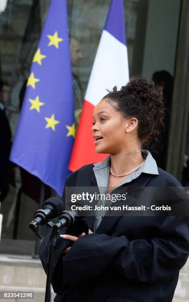 France’s First Lady Brigitte Macron receives singer and songwriter Rihanna at the Elysée Palace on July 26, 2017 in Paris. Main issue of the visit...