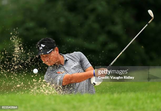 Choi of Korea plays his shot out of the bunker on the eighth hole during round one of the RBC Canadian Open at Glen Abbey Golf Club on July 27, 2017...