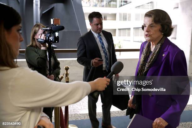 Sen. Dianne Feinstein talks to reporters before heading into a closed-door meeing of the Senate Intelligence Committee in the Hart Senate Office...