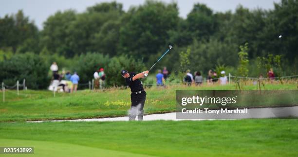 Graeme Storm of England plays his second shot on the 16th fairway during the Porsche European Open - Day One at Green Eagle Golf Course on July 27,...