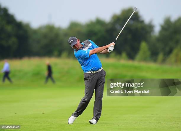 Thomas Bjorn of Denmark plays his second shot on the 16th fairway during the Porsche European Open - Day One at Green Eagle Golf Course on July 27,...