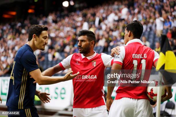 Stefan Ishizaki of AIK and Danilo of SC Braga in discussion during the UEFA Europa League Qualifying match between AIK and SC Braga at Friends arena...