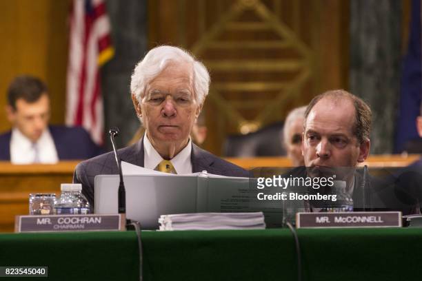 Senator Thad Cochran, a Republican from Mississippi and chairman of the Senate Appropriations Committee, left, listens during a markup hearing in...