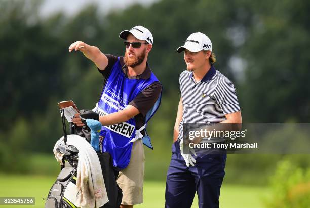 Pontus Widegren of Sweden and his caddy line up his first shot on the 16th tee during the Porsche European Open - Day One at Green Eagle Golf Course...