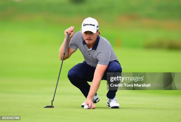 Pontus Widegren of Sweden lines up his putt on the 16th green during the Porsche European Open - Day One at Green Eagle Golf Course on July 27, 2017...