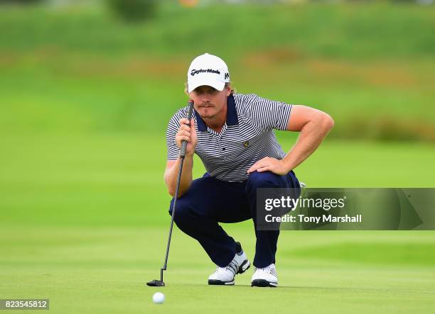 Pontus Widegren of Sweden lines up his putt on the 16th green during the Porsche European Open - Day One at Green Eagle Golf Course on July 27, 2017...
