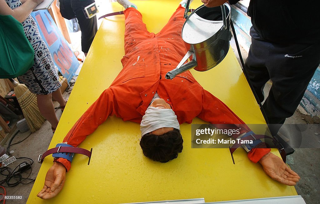 Artist Installs Waterboarding Torture Sideshow At Coney Island