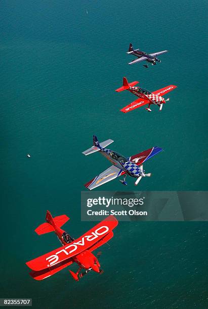 Pilots Sean Tucker , his son Eric , Bill Stein and Ben Freelove fly their aircraft over Lake Michigan as they prepare for this weekend's Chicago Air...