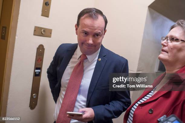 Sen. Mike Lee, R-Utah, talks with reporters in the senate subway before a lunch in the Capitol on July 27, 2017.