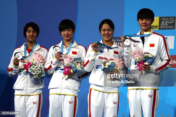 Silver medalists China pose with the medals won during the Womens 4x200m Freestyle final on day fourteen of the Budapest 2017 FINA World...