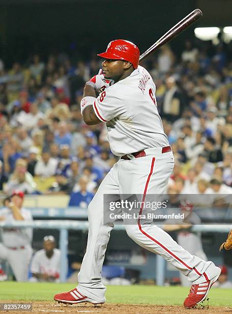 Ryan Howard of the Philadelphia Phillies hits a RBI sacrifice in the seventh inning against the Los Angeles Dodgers at Dodger Stadium on August 14,...