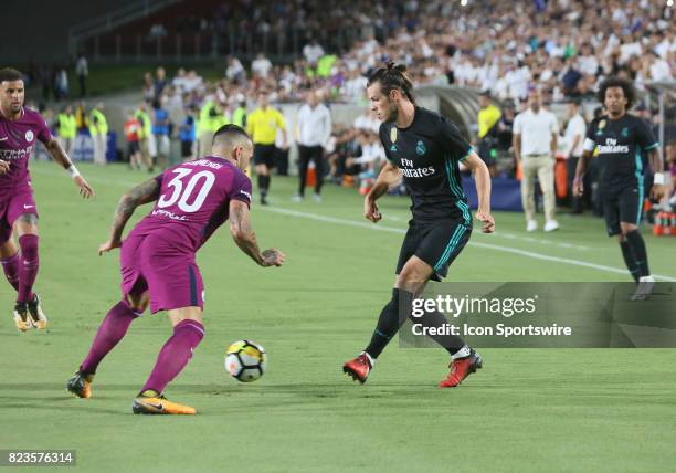 Real Madrid Gareth Bale dribbles past Manchester City Nicolas Otamendi during the game on July 26 at the Los Angeles Coliseum in Los Angeles, CA.