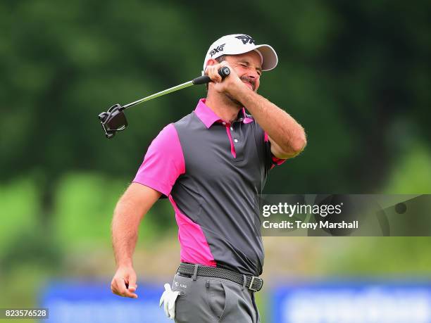 Charl Schwartzel of South Africa narrowly misses a birdie chance on the 9th green during the Porsche European Open - Day One at Green Eagle Golf...