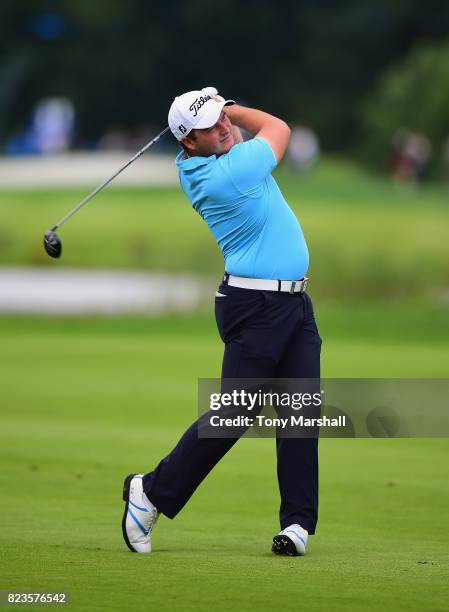 Zander Lombard of South Africa plays his second shot on the 9th fairway during the Porsche European Open - Day One at Green Eagle Golf Course on July...