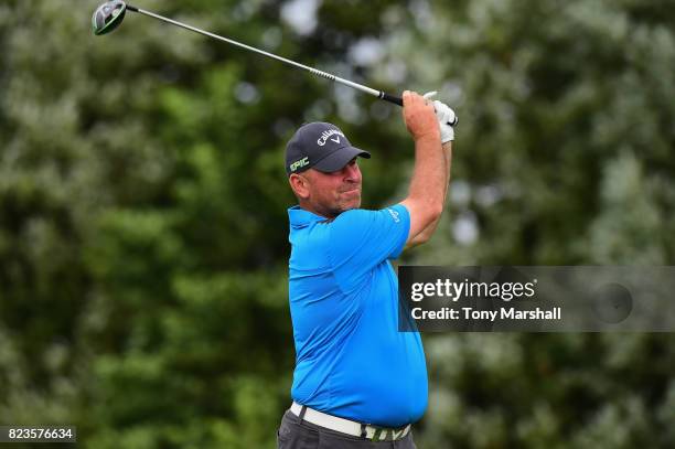 Thomas Bjorn of Denmarks plays his first shot on the 13th tee during the Porsche European Open - Day One at Green Eagle Golf Course on July 27, 2017...
