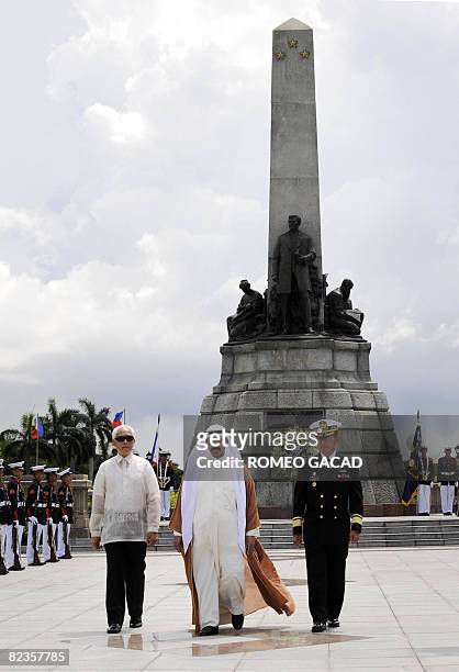 Kuwait's Prime Minister Sheikh Nasser Mohammed al-Ahmed al-Sabah accompanied by Manila Mayor Alfredo Lim and Philippines Navy commander Rear Admiral...