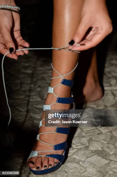 Model poses on the runway with Thesis Shoes at the "Tankovitz on Lincoln Road" event presented by DIVE Swim Week on July 21, 2017 in Miami, Florida.