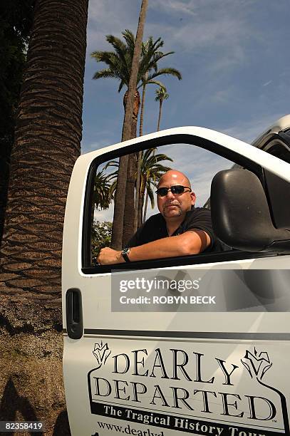 Owner/operator Scott Michaels, who calls himself "the director of undertakings" for his Dearly Departed Tours, poses with his van on Sunset Blvd in...